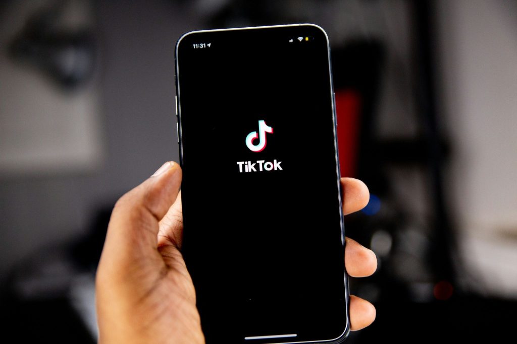 Person opening TikTok on their phone